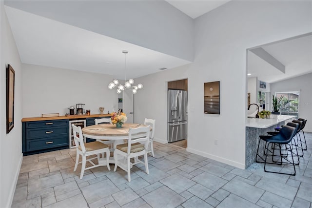 dining room featuring an inviting chandelier and wine cooler