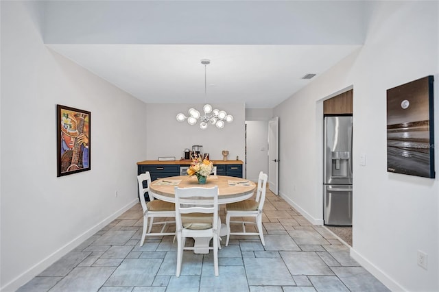 dining room with a notable chandelier