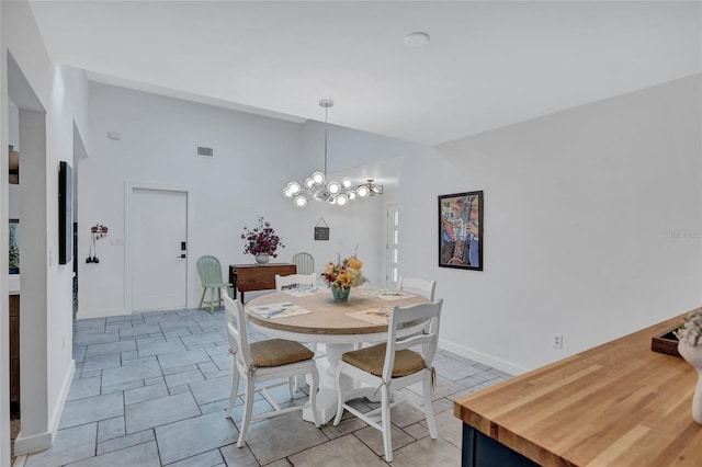 dining room featuring a notable chandelier