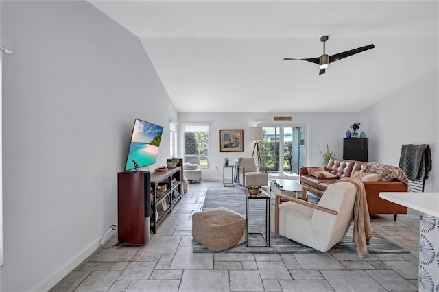 living room with ceiling fan and lofted ceiling