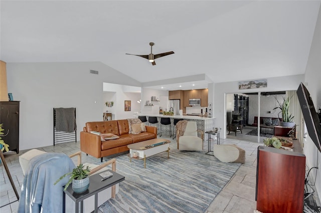 living room with vaulted ceiling and ceiling fan