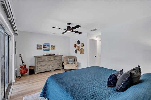 bedroom with ceiling fan and light wood-type flooring