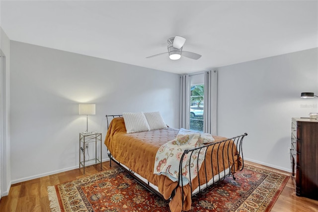 bedroom featuring hardwood / wood-style floors and ceiling fan