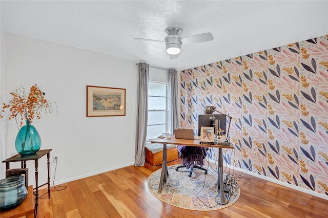 office space with light wood-type flooring and ceiling fan