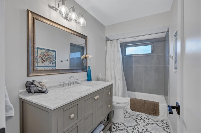 full bathroom featuring tile patterned flooring, vanity, toilet, and shower / bathtub combination with curtain