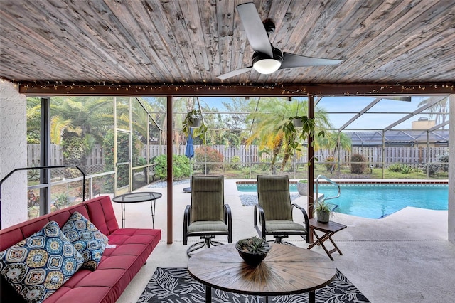 exterior space with a lanai, a patio area, ceiling fan, and an outdoor hangout area