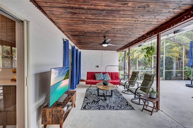 sunroom / solarium featuring ceiling fan and wood ceiling