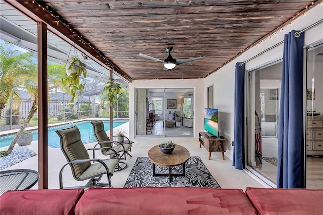 sunroom / solarium with ceiling fan and wooden ceiling