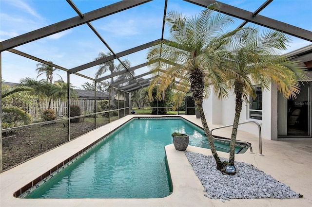 view of pool with a lanai and a patio