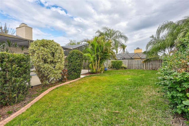 view of yard with a lanai