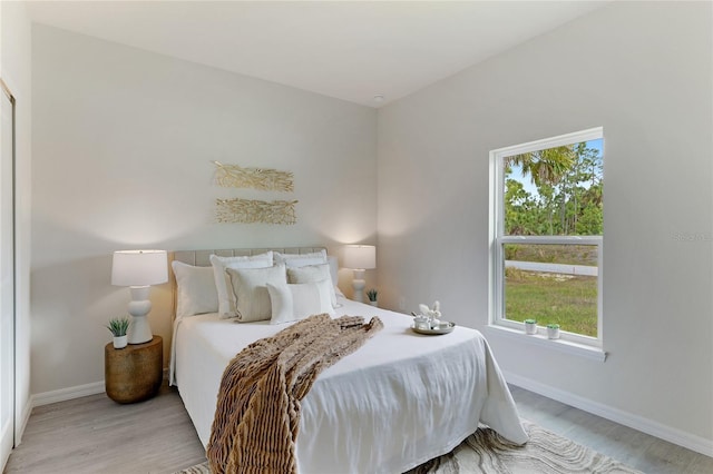 bedroom with light hardwood / wood-style floors