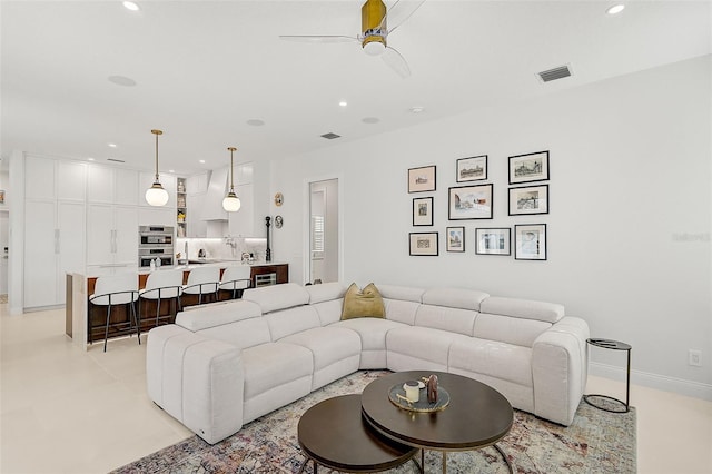 living room with ceiling fan