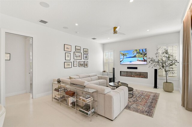 2112 Calusa Lakes Blvd, Nokomis, FL 34275 - living area featuring a ceiling fan, a glass covered fireplace, and recessed lighting
