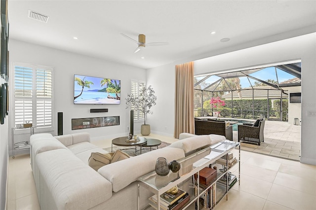 tiled living room featuring ceiling fan