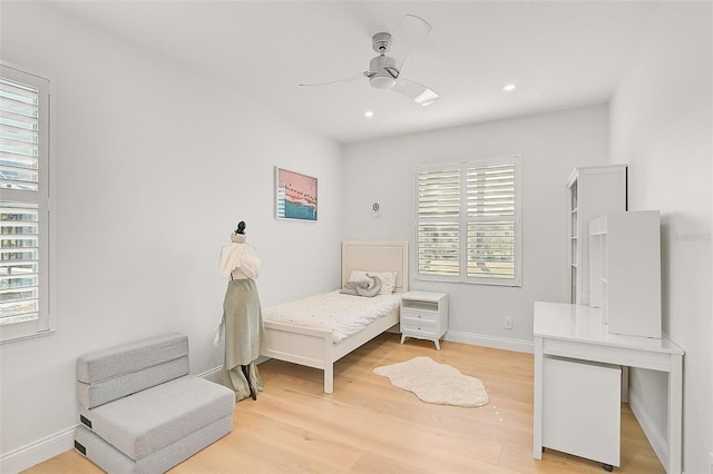 bedroom with hardwood / wood-style floors and ceiling fan