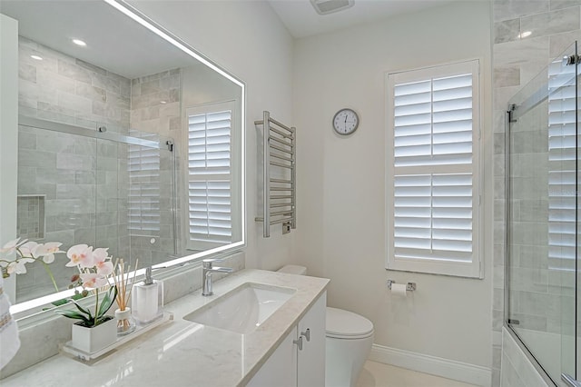 2112 Calusa Lakes Blvd, Nokomis, FL 34275 - bathroom featuring vanity, radiator heating unit, and a towel warming rack