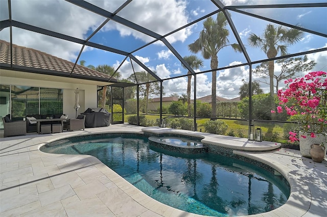 view of pool with an in ground hot tub, area for grilling, outdoor lounge area, glass enclosure, and a patio