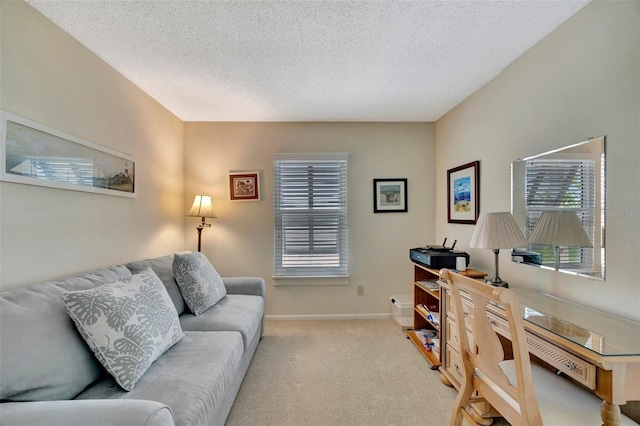 carpeted home office with a textured ceiling