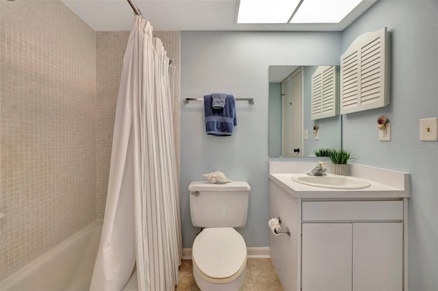 full bathroom featuring vanity, a skylight, tile patterned flooring, toilet, and shower / bathtub combination with curtain