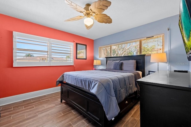 bedroom featuring hardwood / wood-style flooring and ceiling fan