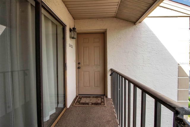 entrance to property featuring a balcony