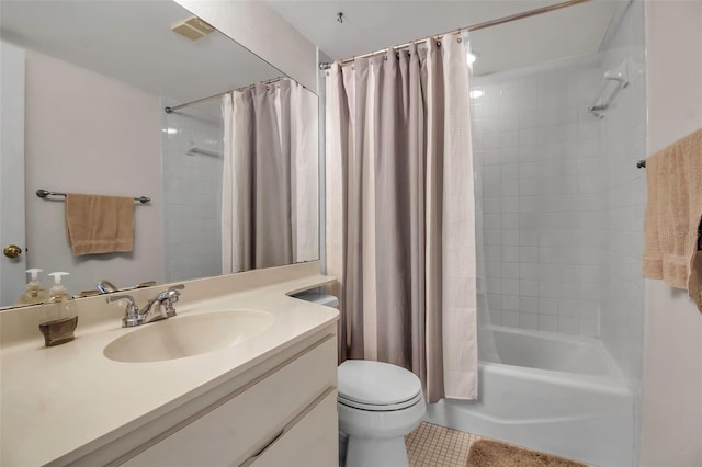 full bathroom with tile patterned floors, vanity, shower / tub combo, and toilet