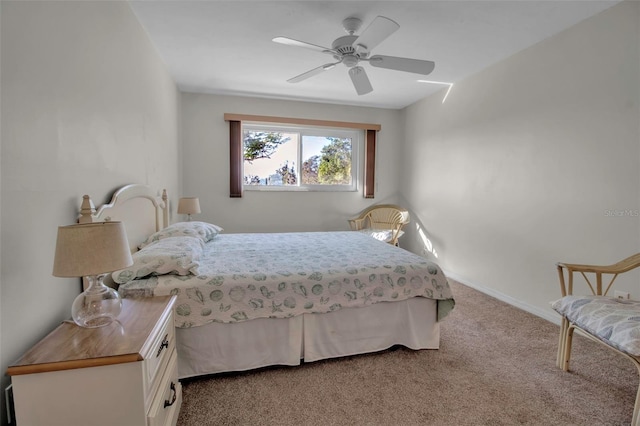 bedroom featuring light carpet and ceiling fan