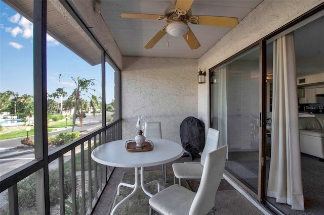 balcony featuring ceiling fan