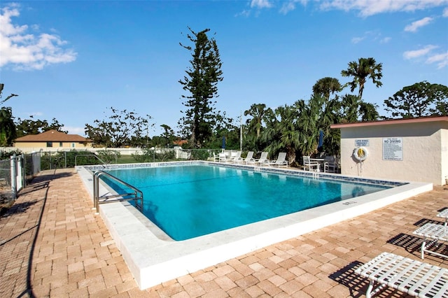 view of pool featuring a patio area