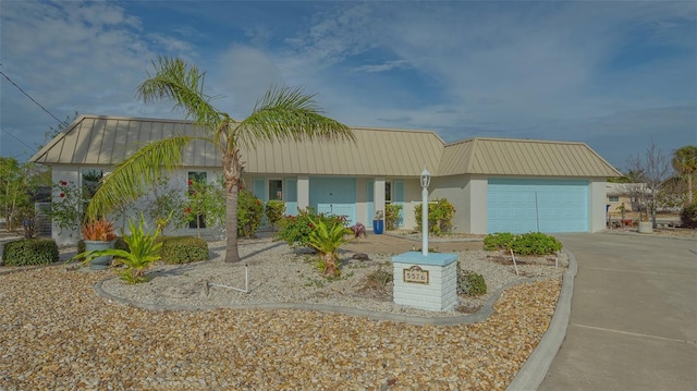 view of front of property with a garage