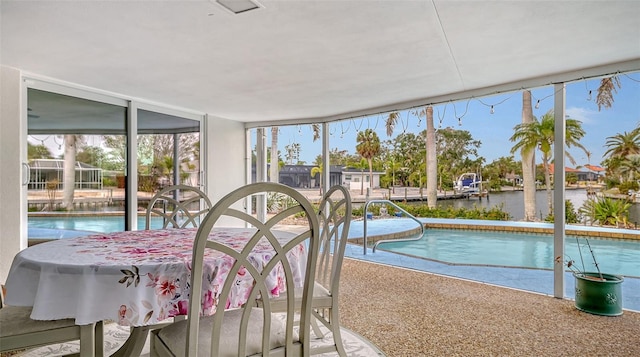 sunroom with a water view