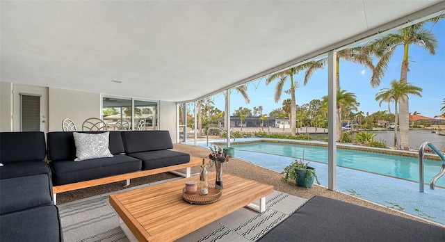 exterior space featuring an outdoor hangout area, a water view, and a patio area