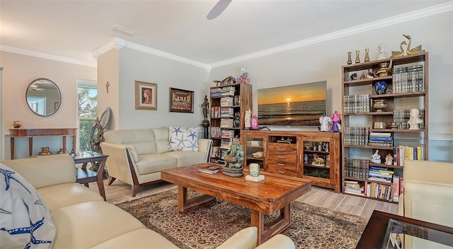 living room featuring ceiling fan and crown molding