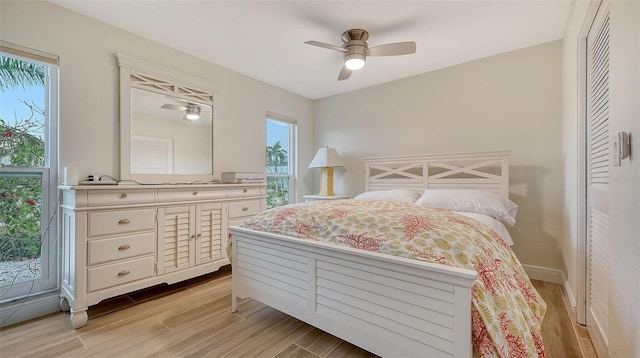 bedroom featuring ceiling fan and a closet