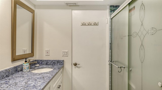 bathroom featuring vanity and walk in shower