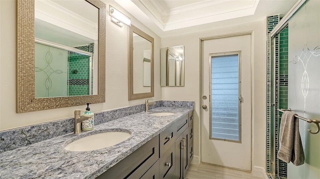 bathroom featuring walk in shower, vanity, and ornamental molding