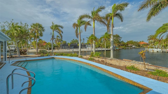 view of swimming pool featuring a water view