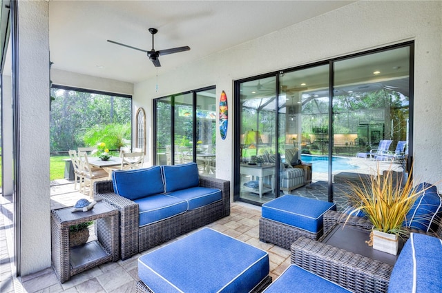 sunroom / solarium with ceiling fan