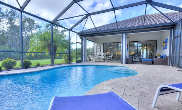 view of pool with a lanai, a patio area, and an outdoor hangout area