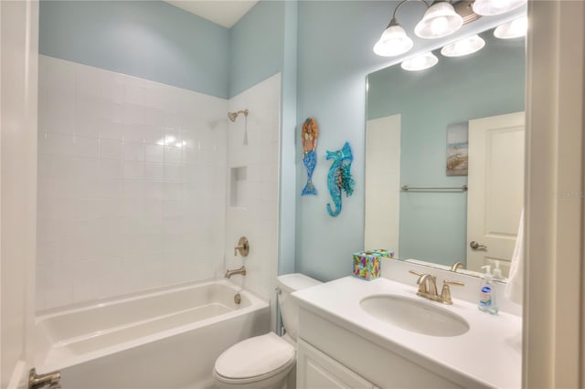 full bathroom featuring vanity, toilet, and tiled shower / bath