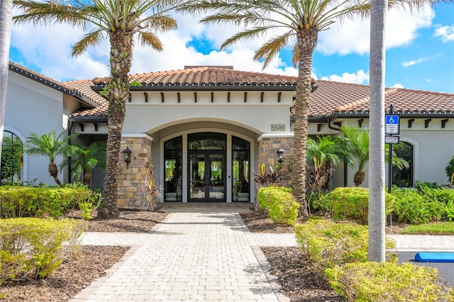 view of exterior entry featuring french doors