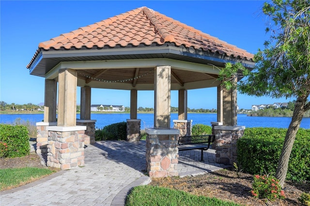 view of community featuring a gazebo and a water view