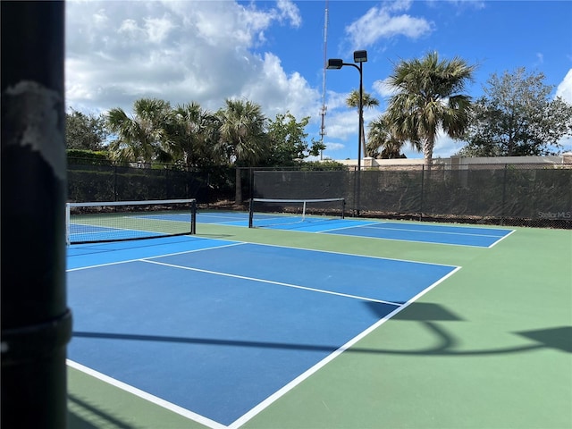 view of sport court featuring basketball hoop