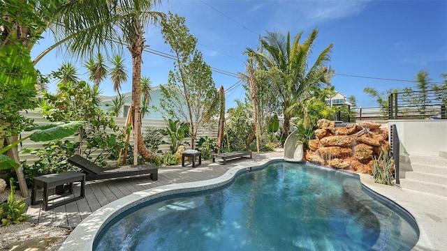 view of swimming pool featuring a deck