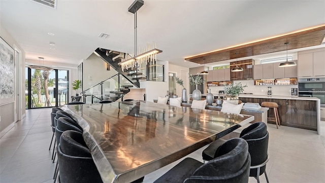 dining space with light tile patterned floors