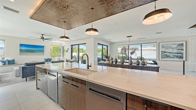 kitchen with dishwasher, pendant lighting, a wealth of natural light, and sink