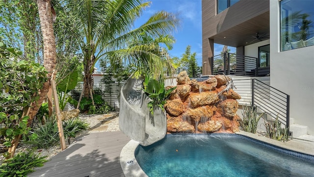 view of swimming pool with ceiling fan