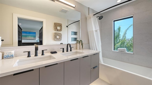 bathroom with vanity and shower / tub combo with curtain