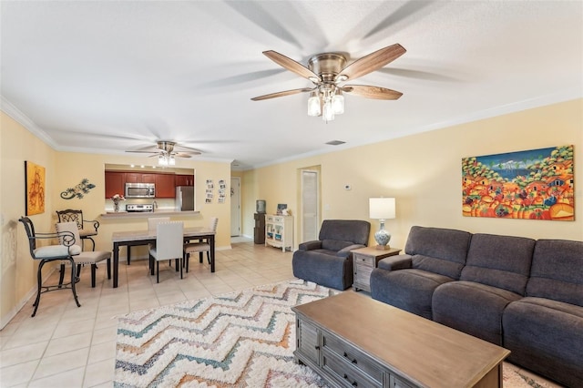 tiled living room with ceiling fan and ornamental molding