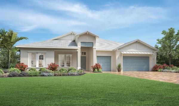 view of front of property with a garage, a front yard, and french doors